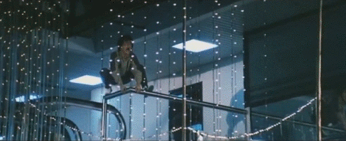 Chan leaps from a 4th(?)-floor mezzanine onto a pole in the film's most famous stunt.